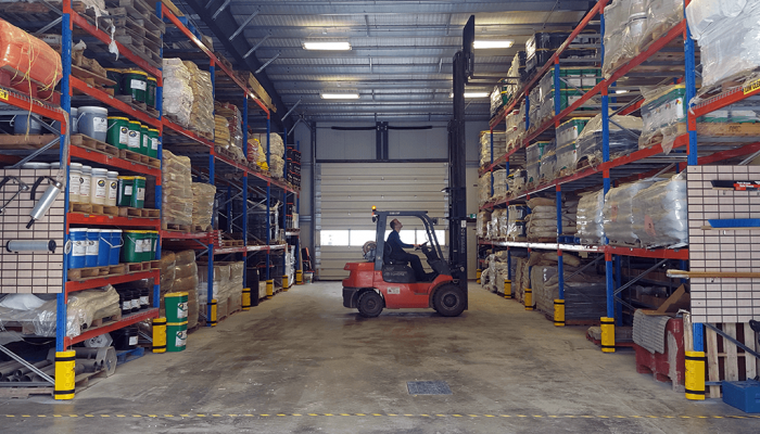 Warehouse-Interior-Alan-on-Forklift.png